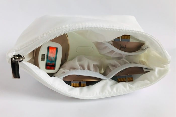 The zip-close white padded storage pouch protects the device and treatment windows