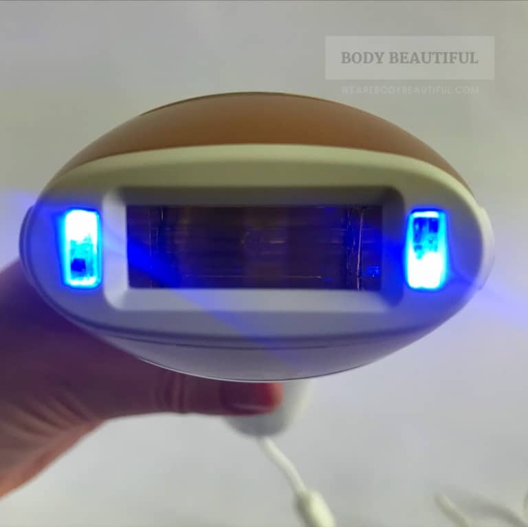 photo of the flash window with the 2 skin tone sensors activated and illuminated bright blue.