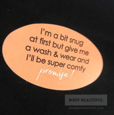 Sticker reads "I'm abit snug at first but give me awash & wear and I'll be super comfy - Promise!