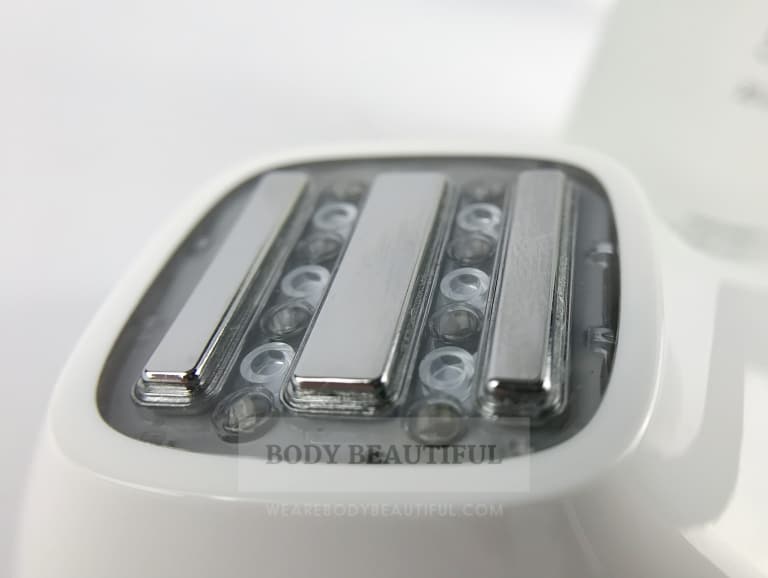 Close-up of the Silk'n FaceTite treatment head with 3 RF bars and 3 LED lights between each