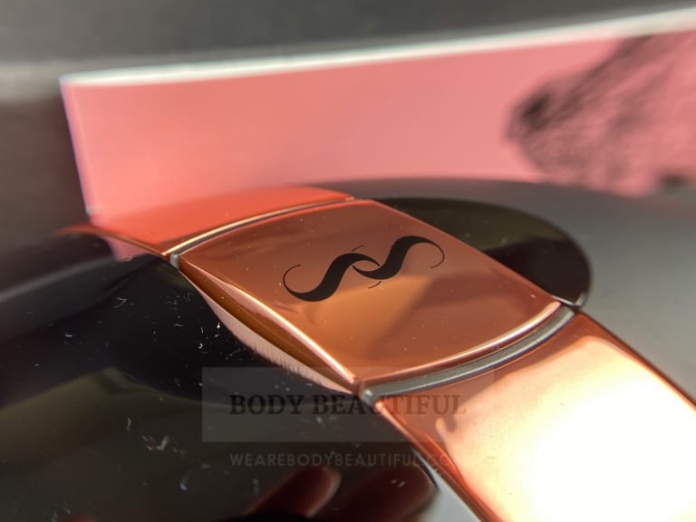 Close-up photo of the cute rose-gold ribbon detailing and 'SS' logo on the Bare+ home IPL device