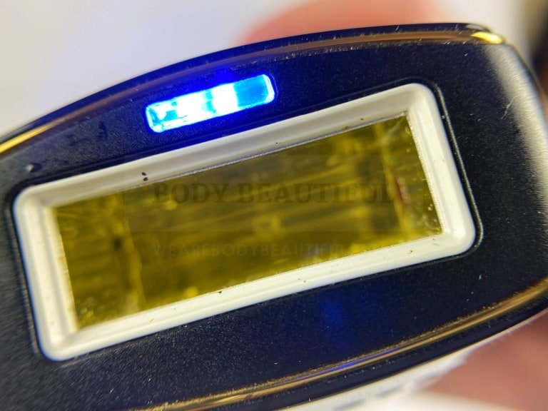 Close up of the small blue skin sensor light above the flash window on the Smoothskin Pure