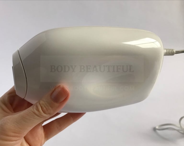 Dimple at comfortable grip point on the underside of the Iluminage Precise Touch IPL device