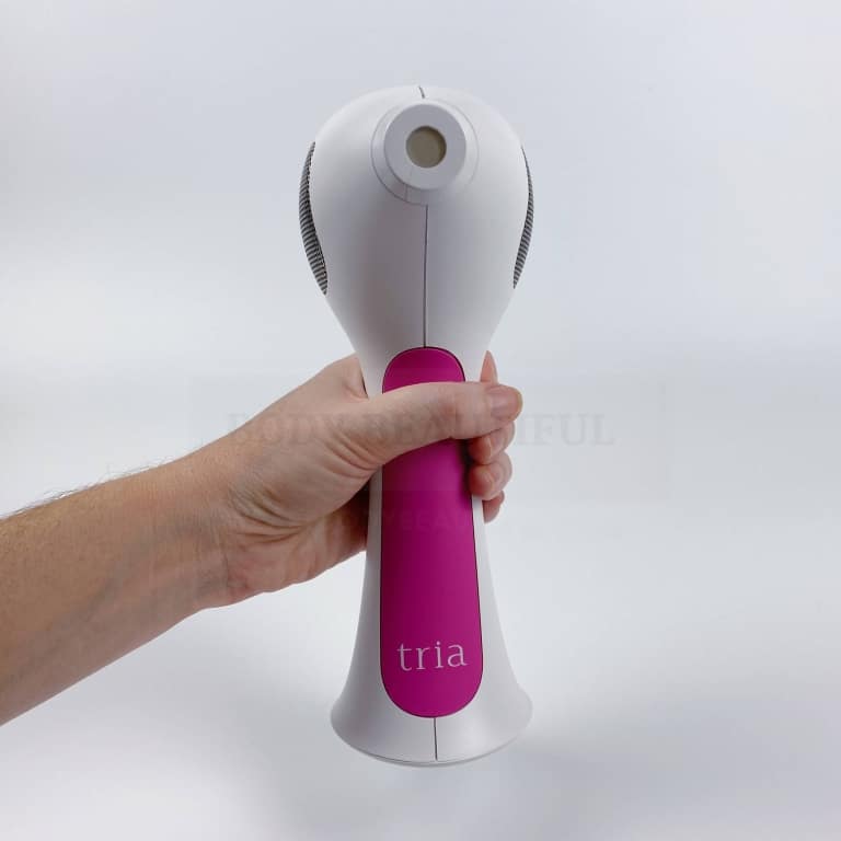 hand holding the Tria 4X laser balanced in a comfy upright position