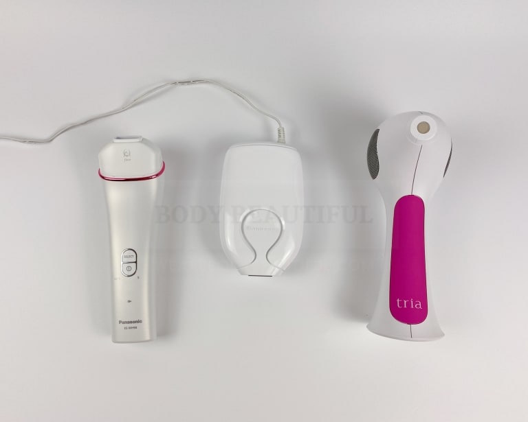 Top down shot of WeAreBodyBeautiful.com's three recommended home devices for facial hair removal