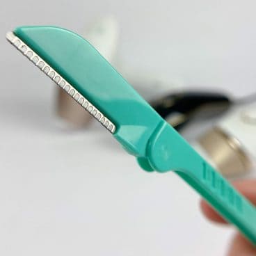 A dermaplaning tool called Hollywood Browser. These tools are excellent for cutting facial hair and removing peach fuzz.