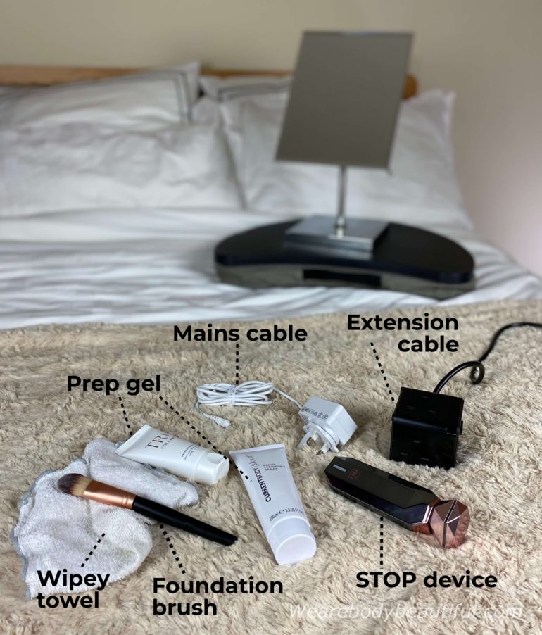 Equipment for my Tripollar Stop VX RF sessions: pedastal mirror on a laptop try, mains extension cable, STOP VX device, prep gel, foundation brush, wipey towel and mains cable and plug.