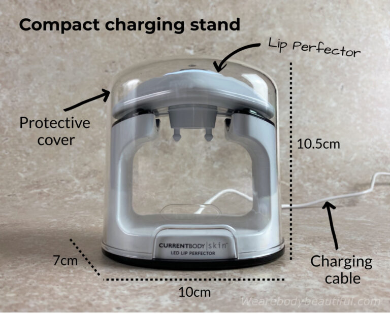 The Lip Perfector sits on top of the small charging stand protected by the clear plastic cover, and connected from the bottom of the stand to the mains by the USB charging cable, The stand measures 10cm long, 7 cm wide, and 10.5 cm high.