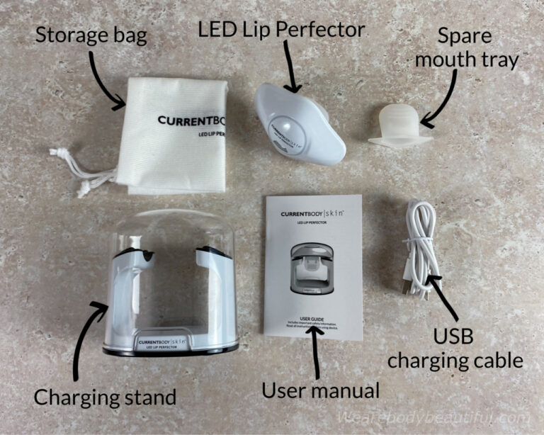The contents of the CurrentBody Skin Lip Perfector kit: LED Lip Perfector, User manual, USB charging cable, Charging stand, Storage bag