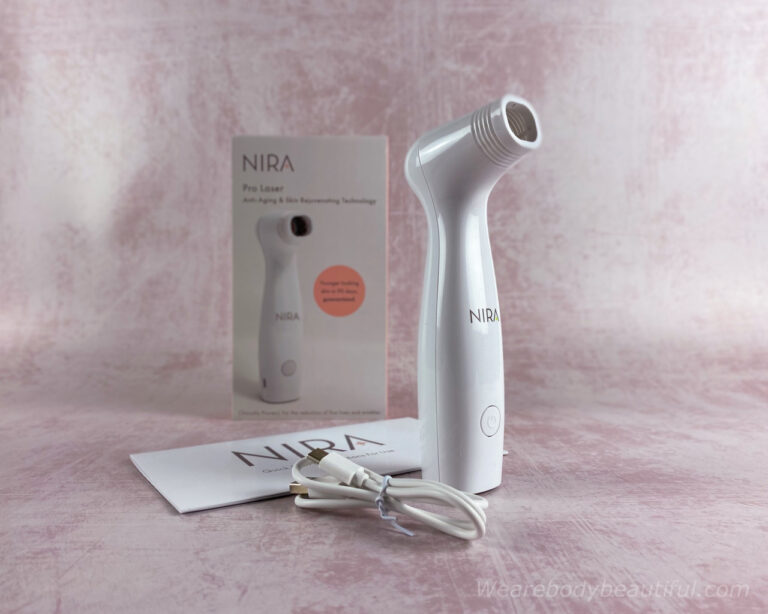 The teeny white NIRA Pro laser proudly shows off his long and large snout (that's his laser aperture, if you must know). Learn the detailed pros and cons in this NIRA Pro laser review.