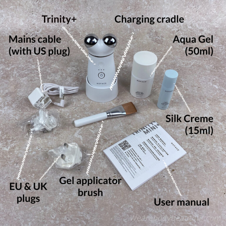 In the Trinity+ microcurrent kit: Trinity+ device, Charging cradle, User manual, Power adaptor (with US plug), UK plug, EU plug, Aqua Gel (50ml), Silk Creme (15ml), Gel applicator brush.
