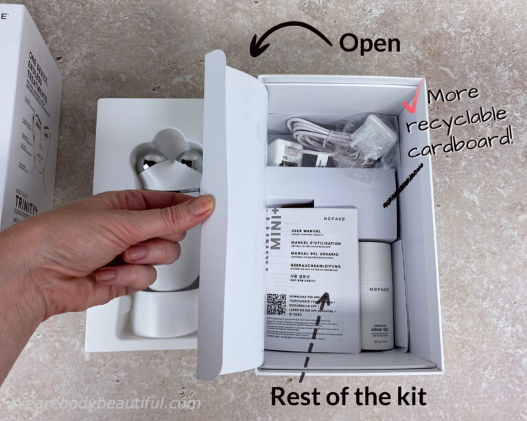 Cut the security tabs top and bottom and slide off the sleeve to get to the kit inside. First, you see the Trinity+ device and charging cradle secure in a white plastic moulded tray. Note the thumb grab recess between the Trinity+ silver electrodes.