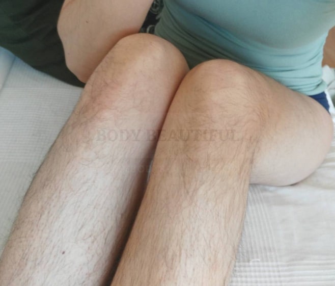 Photo of long dark soft hair on a lady's legs