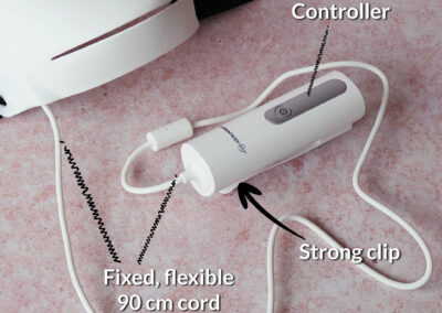 Close up of the Series 2 mask small white controller fixed to the mask via a 90cm flexible cord. There’s a strong plastic clip on the back of the controller too.