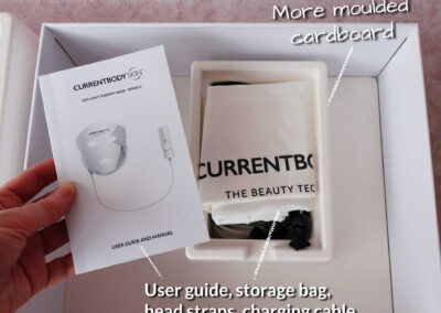 Lift out the cardboard tray and below is a smaller moulded cardboard section that secures the charging cable, head straps, storage bag and user guide.