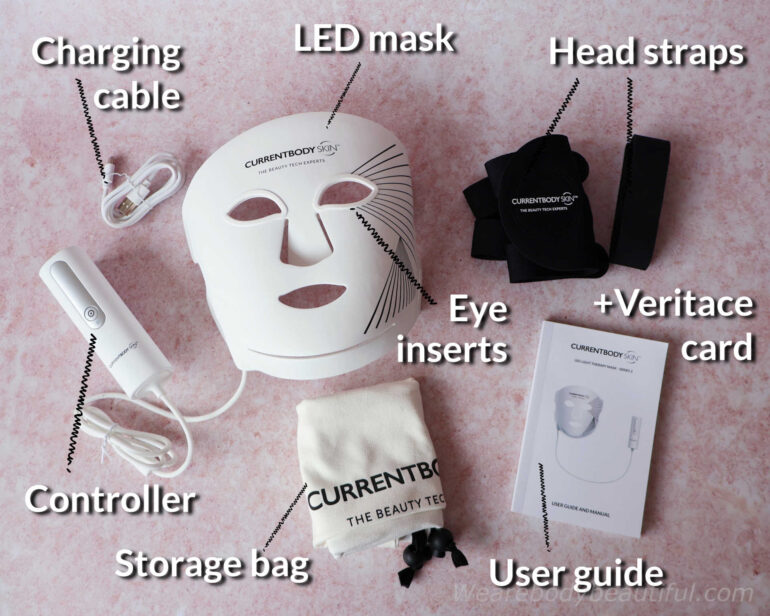 In the CurrentBody Skin LED Light Therapy Face Mask: Series 2 kit: The white silicone mask with eye inserts and controller attached via a cord, user guide booklet, folded white fabric storage bag, black folded head straps, and Veritace card.
