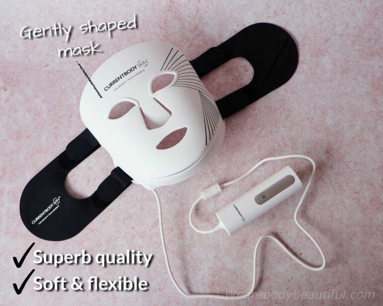 Top-down shot of the Series 2 LED mask with head straps attached, and the controller coiled around the bottom. The mask is superb quality, soft & flexible, and gently shaped.